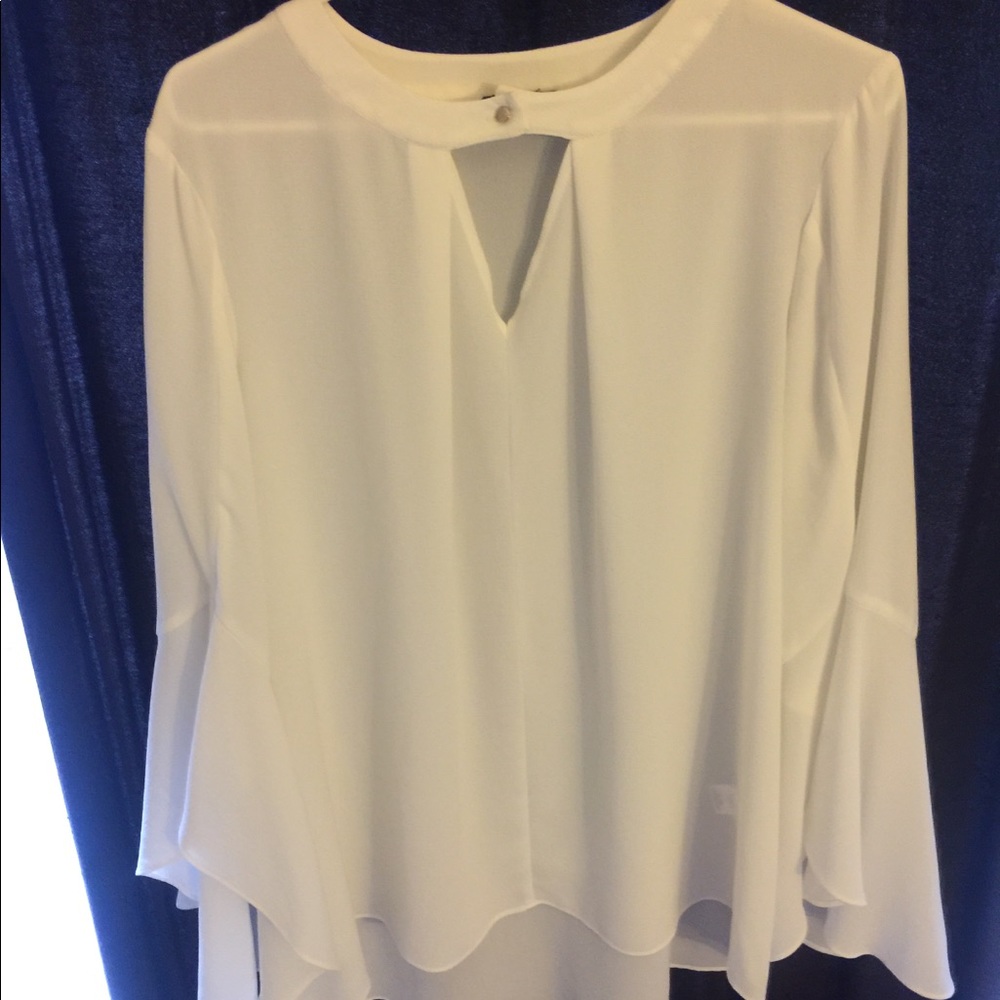 White bell-bottom sleeved women’s blouse